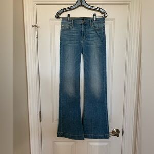 7 for all mankind flared jeans in medium/ light blue wash.